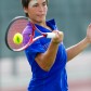 Tennis player makes contact with the ball during a tournament at the AnneMarie Tennis Center in San Antonio