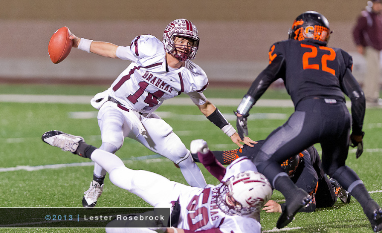 Grant Aschenbeck (East Bernard Brahmas) attempts to elude Alex Coronado (Refugio Bobcats) during the Texas UIL 2A Quarterfinal football game in San Antonio. Refugio went on to win the game 40-30 and moves on to play Waskom in the Semi-finals.