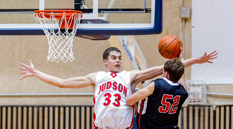 David Wacker (Judson Rockets) tries to block a shot by Braeden Bernstein (Churchill Chargers) during the UIL 5A Regional Quarter Finals at UTSA. Judson won the game 54-34 and moves on to play Edinburg North in the Regional Semi-Finals.  Click here for more photos