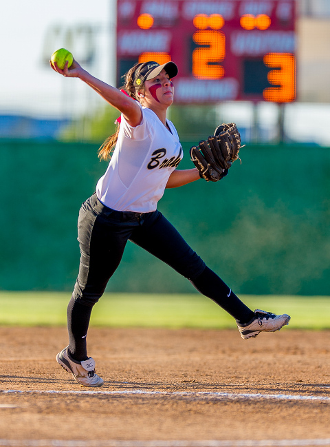 King high school (Kingsville, Tx) Sam Cuellar fires the ball to first base in a regional semifinal game against LaVernia.