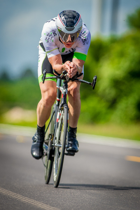 The time trial is a race of one rider vs the clock. There is no drafting or assistance from other cyclists, if you get a flat then your day is over. Every piece of the bike is scrutinized for optimal performance to slice through the wind. Even the clothes are carefully chosen, a flapping jersey or poorly pinned number (like the photo here) acts like a parachute and slows you down. Click here to purchase photographs.