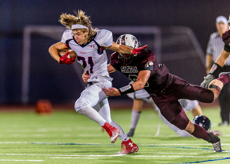 Wimberley Texan Hunter Johnson lost his helmet but keeps on running during a Texas UIL playoff game against Sinton.
