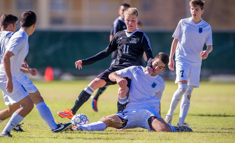 Johnson Jaguar Santiago Macias attempts to steal the ball from Cibolo Steele Knights during a game.