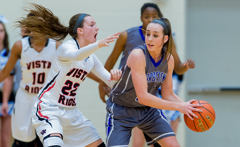 Vista Ridge SG Katrina Pardee keeps the pressure on Georgetown player Kendrick Clark during 5A Regional Final action. Vista Ridge won the game 53 - 40 and advances to the championship game.