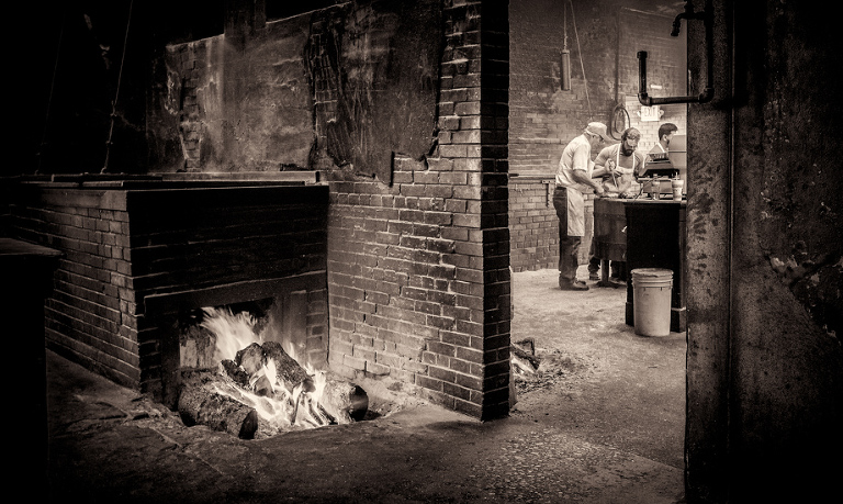 Workers prepare bbq for customers at Smitty's Market in Lockhart.